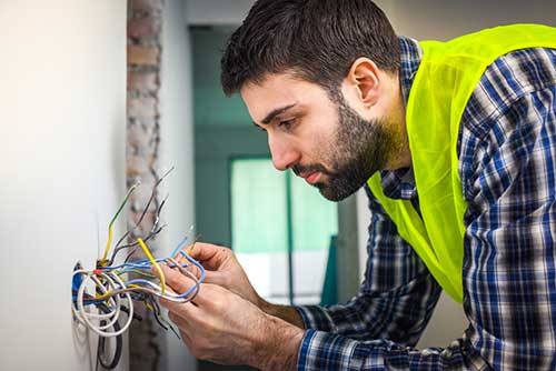 An electrician servicing a residence