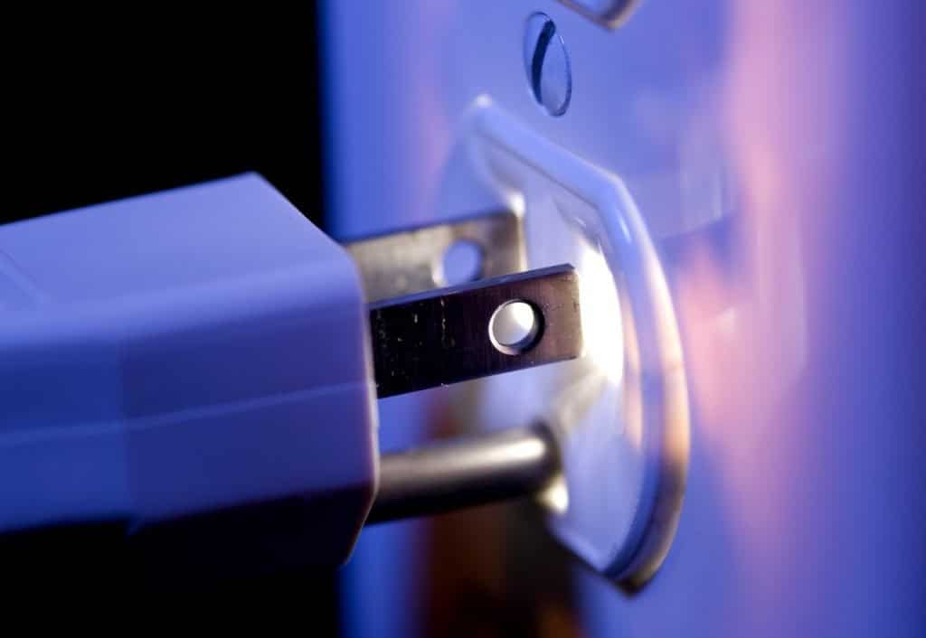 glowing electrical outlet and plug