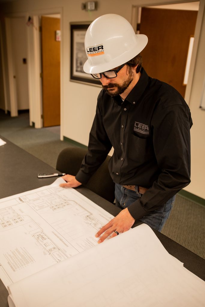 Leer Electric, Inc. electrician looking at commerical design