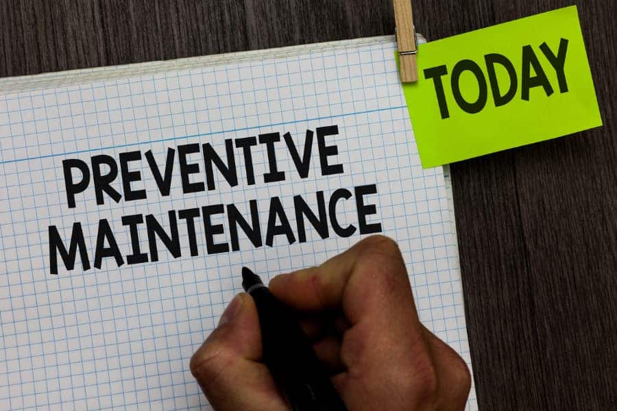 Preventive Maintenance Written on Graph Paper With Today Sticky Note